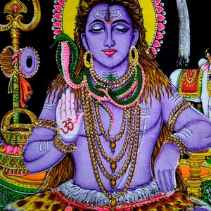 May include: A colorful tapestry depicting a Hindu deity, Shiva, with a snake around his neck. He is sitting with his hands in a mudra gesture, wearing a beaded necklace and a tiger skin. The tapestry is decorated with intricate details and vibrant colors.