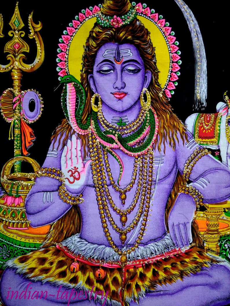 May include: A colorful tapestry depicting a Hindu deity, Shiva, with a snake around his neck. He is sitting with his hands in a mudra gesture, wearing a beaded necklace and a tiger skin. The tapestry is decorated with intricate details and vibrant colors.