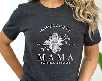 May include: A dark gray t-shirt with a white floral design and the text "HOMESCHOOL P.R. 22:6 MAMA RAISING ARROWS".