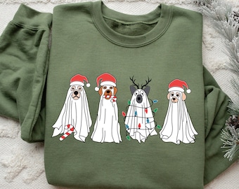 May include: Green sweatshirt with a Christmas-themed graphic of four dogs dressed as ghosts. The dogs are wearing Santa hats and have candy canes and Christmas lights.