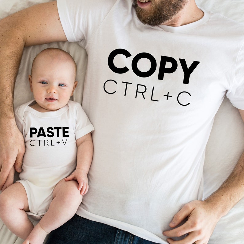 May include: A white t-shirt with the text "COPY CTRL+C" and a white onesie with the text "PASTE CTRL+V".