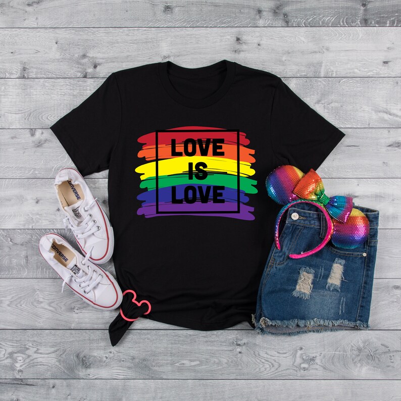 May include: Black t-shirt with a rainbow design and the text "LOVE IS LOVE" in a black square.