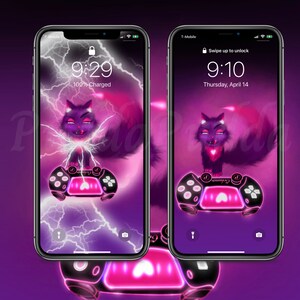 May include: Two smartphones showing a digital art wallpaper in purple and pink. The wallpaper depicts a cartoon cat with a heart-shaped chest, on a game controller. The left phone shows a lightning effect and the time 9:29, 100% charged.