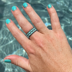 Miyuki 11/0 Delica seed bead ring woven together with the Peyote stitch.