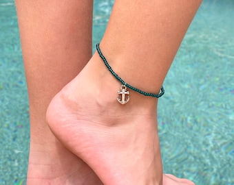 Cute stretchy anklet or bracelet made with 8/0 seed beads in your choice of color with a silver anchor charm.