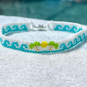 Miyuki 11/0 Delica seed bead bracelet in peyote stitch in a wave pattern with palm trees and sun