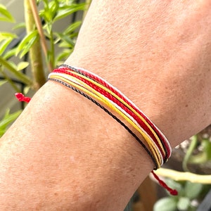 Pura Vida style waterproof waxed polyester cord bracelet in sports team colors