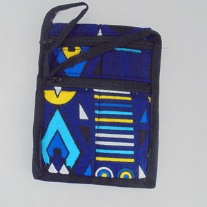 May include: A small blue and yellow patterned zippered pouch with a black strap. The pouch has two zippers and a black trim.