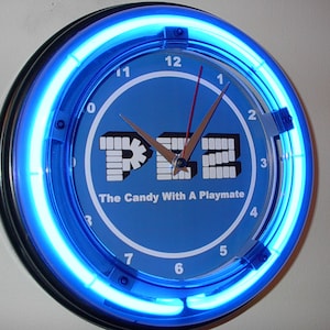 PEZ Candy Dispenser Store Bar Advertising Man Cave Blue Neon Wall Clock Sign