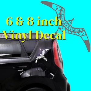 May include: A white vinyl decal of a stylized bird with a tribal pattern. The decal is shown on the back window of a black car. The decal is available in 6 and 8 inch sizes.