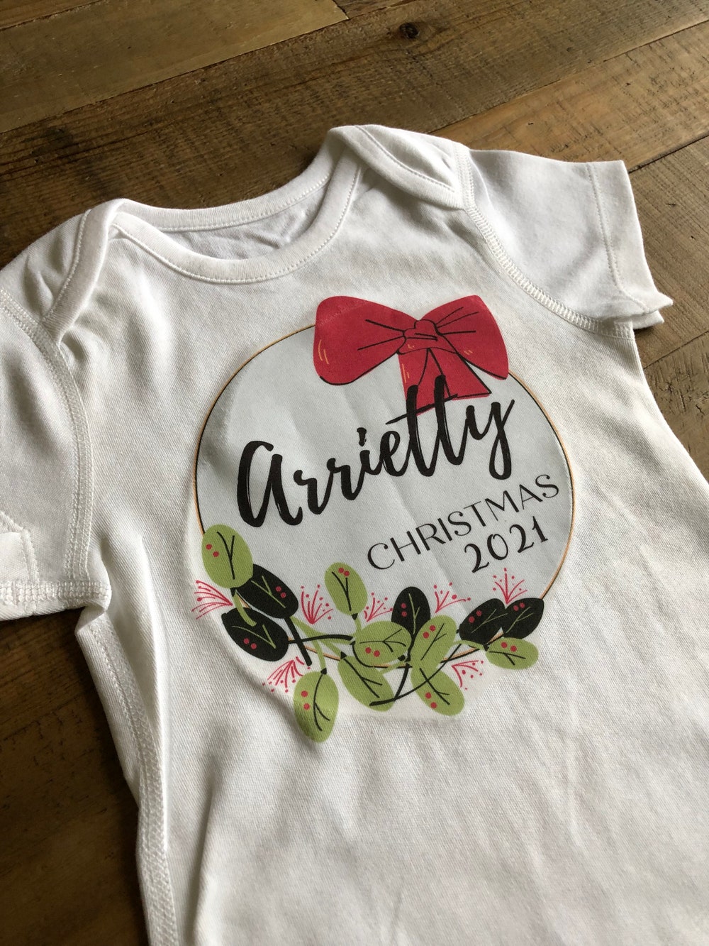 Personalised Christmas Baby Vest Or T-Shirt With Wreath And Bow Design - Baby'S First Christmas Or Christmas 2021 Customised With Their Name