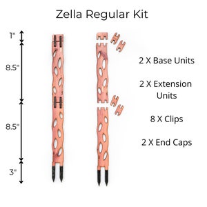 May include: The Zella Regular Kit includes two base units, two extension units, eight clips, and two end caps. The wooden pieces are light brown with a series of oval cutouts. The base units are 8.5 inches long, and the kit includes a 3-inch stake.