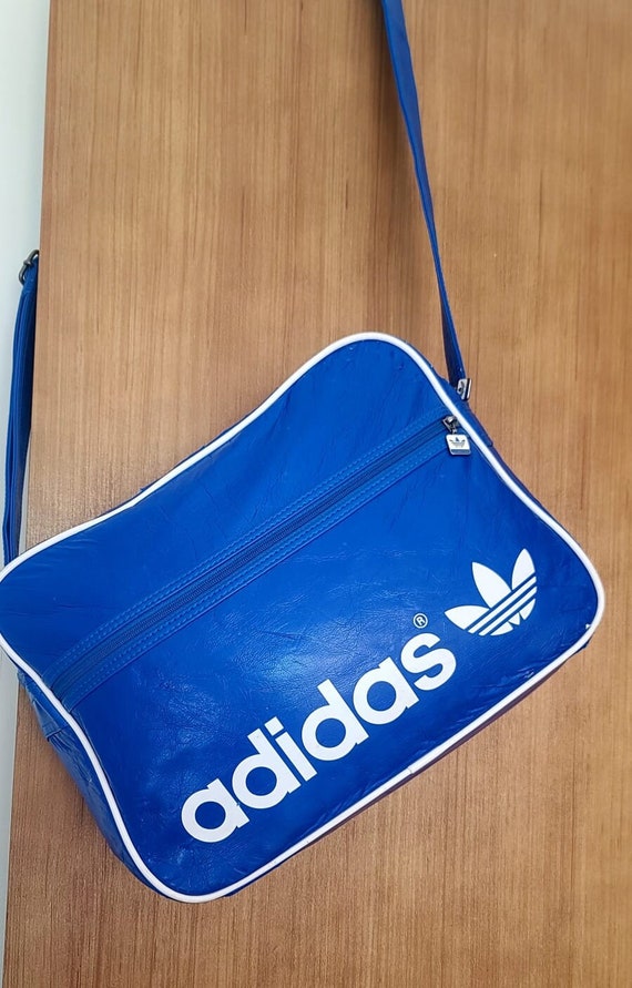 Rare Vintage Adidas 90s blue and white Duffle faux le… - Gem