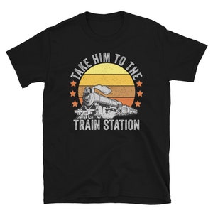 May include: Black t-shirt with a vintage-style graphic of a train and the text "Take Him To The Train Station".