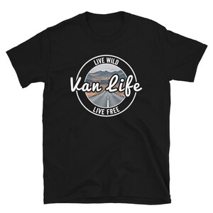 May include: Black t-shirt with a white circle graphic that says "Live Wild Van Life Live Free" with a picture of a road in the mountains.