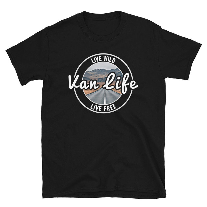 May include: Black t-shirt with a white circle graphic that says "Live Wild Van Life Live Free" with a picture of a road in the mountains.