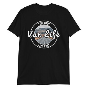 May include: Black t-shirt with a white circle graphic that says "Live Wild Van Life Live Free" with a picture of a road in the mountains.