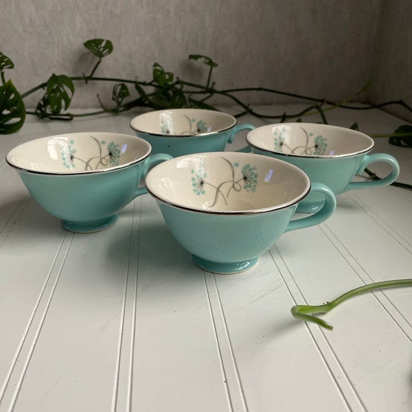 Set of 4 matching turquoise tea cups rimmed in silver/with dandelion design