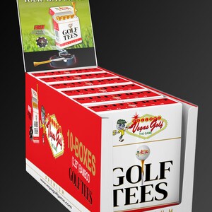 May include: Display box of Vegas Golf golf tees. The box is red and white with the text "GOLF TEES" and "PREMIUM". The display also features the text "SMOKE YOUR NEXT DRIVE".