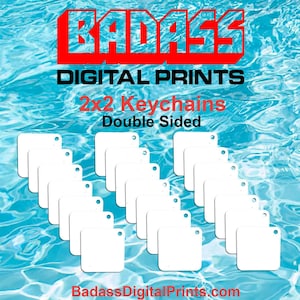 May include: A set of 25 blank, white, 2x2 inch, double-sided keychains. The keychains are arranged in rows on a blue background. The text "Badass Digital Prints" is at the top of the image.