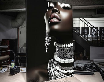 May include: A black and white portrait of a woman wearing a variety of silver and white necklaces and earrings. The woman's eyes are closed and her lips are slightly parted.