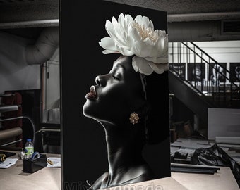 May include: A black and white portrait of a person with their eyes closed. A large white flower is on top of their head. The background is black.