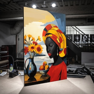 May include: A painting of a woman with dark skin wearing a yellow, red, and black head wrap. She is looking down at a bowl of fruit. The background is a yellow and blue landscape with sunflowers in a vase.