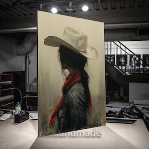 May include: A painting of a woman wearing a white cowboy hat and a red scarf. The woman is facing away from the viewer and her long dark hair is flowing down her back. The background is a muted brown color.