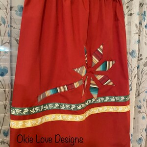 Ribbon Skirt- Rust colored fabric with sky star flower