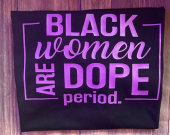 May include: Black t-shirt with a purple graphic that says "Black women are dope period."