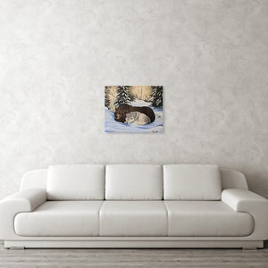 May include: A painting of two dogs cuddling in the snow. The dog on top is brown and white, and the dog on the bottom is white. The background is a snowy forest.