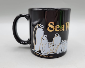 Vintage 1991 Sea World Black Ceramic Mug With Gold Logo Penguin Whale  Graphics
