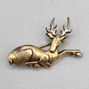Vintage MMA Gold Brass Reclining Deer Stag Brooch Pin