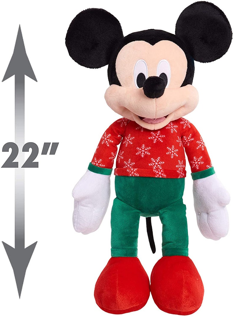 May include: A 22-inch plush Mickey Mouse wearing a red sweater with white snowflakes and green pants.