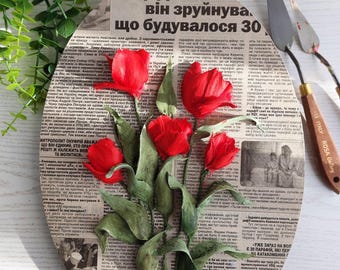 Sculptural painting of red tulips, 3d flowers on newspaper, volumetric painting on newspaper, three-dimensional painting, tulips of plaster