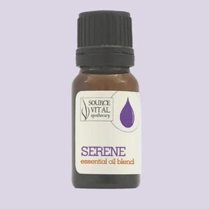May include: A brown glass bottle with a black cap, labeled "SERENE essential oil blend." The label features a purple teardrop graphic and the text "SOURCE VITAL apothecary."