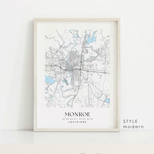 May include: A black and white map of Monroe, Louisiana in a modern style. The map shows the city's streets, rivers, and lakes. The city's name and coordinates are printed at the bottom of the map.