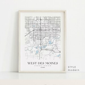 May include: A black and white map of West Des Moines, Iowa, with a modern style. The map shows the city's streets, parks, and bodies of water. The city's name is printed in black at the bottom of the map, along with the coordinates and the state. The word "style" and the word "modern" are printed in black at the bottom right corner of the map.