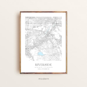 May include: A black and white map print of Riverside, California. The map shows the city's streets and landmarks. The text "Riverside, California 33°54'53" N / 117°23'44" W" is printed below the map.