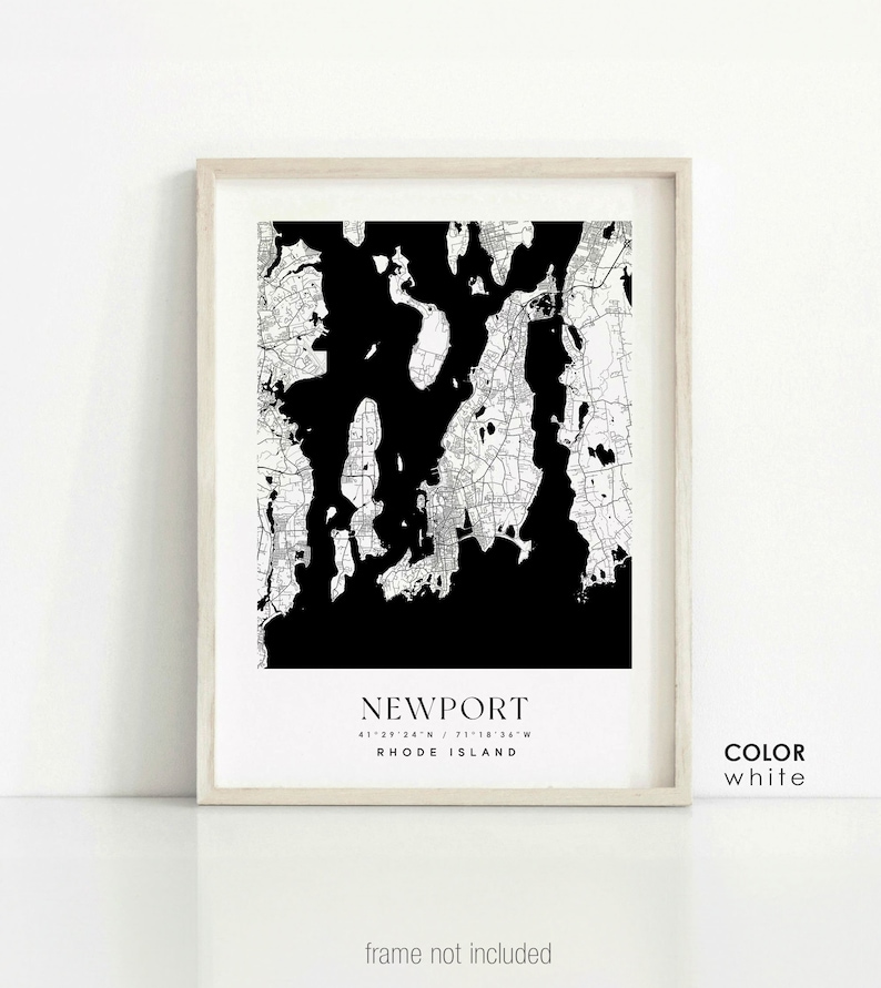 May include: Black and white map print of Newport, Rhode Island with the coordinates 41&deg;29'24"N / 71&deg;18'36"W. The print is framed in a light wood frame and has the word "COLOR" and "white" written below the map.
