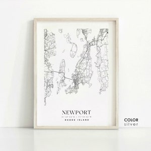 May include: Black and white line art map print of Newport, Rhode Island with the city name and coordinates. The print has a white background and a light wood frame. The text "COLOR silver" is in the bottom right corner.