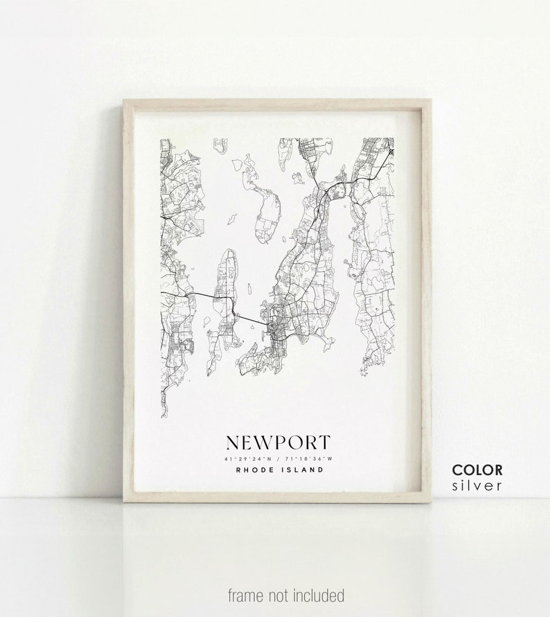 May include: Black and white line art map print of Newport, Rhode Island with the city name and coordinates. The print has a white background and a light wood frame. The text "COLOR silver" is in the bottom right corner.