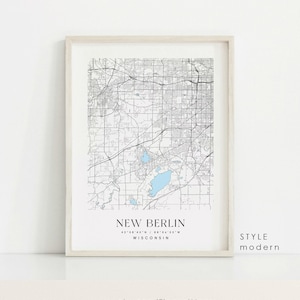 May include: A black and white map print of New Berlin, Wisconsin. The map shows the city streets and bodies of water. The text "NEW BERLIN" is printed at the bottom of the map, along with the coordinates "43°06'45"N / 88°04'33"W". The text "STYLE modern" is printed in the bottom right corner.