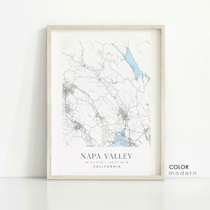 May include: A black and white map print of Napa Valley, California. The map shows the roads and waterways of the region. The text "NAPA VALLEY" is printed at the bottom of the map, along with the coordinates "38°23'12" N / 122°21'05" W".