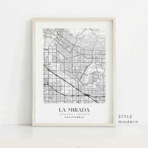 May include: A black and white printable map of La Mirada, California in a white frame. The map shows the city streets and landmarks. The text "LA MIRADA" is printed at the bottom of the map, along with the coordinates "33°54'08"N / 118°0'35"W" and the word "CALIFORNIA". The text "STYLE modern" is printed in the bottom right corner of the image.
