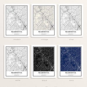May include: Six framed map prints of Marietta, Georgia, in various color schemes: modern, vintage, silver, white, black, and navy. Each map features the city's street layout and is labeled with the city name and coordinates.