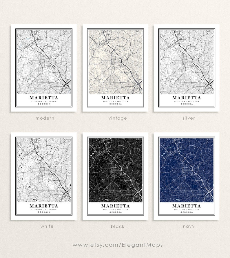 May include: Six framed map prints of Marietta, Georgia, in various color schemes: modern, vintage, silver, white, black, and navy. Each map features the city's street layout and is labeled with the city name and coordinates.