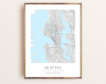 May include: A black and white map of Seattle, Washington with a light blue background. The map shows the city's streets and waterways. The text "Seattle" is printed at the bottom of the map, along with the coordinates "47°36'33"N / 122°19'59"W" and the word "WASHINGTON". The word "modern" is printed below the map.