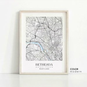 May include: A black and white map print of Bethesda, Maryland. The map shows the city streets and the Potomac River. The text "Bethesda, Maryland 38°59'05"N / 77°05'47"W" is printed below the map.