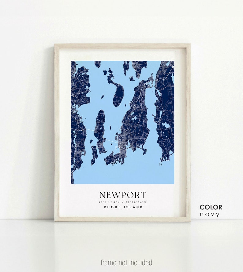 May include: A navy blue map print of Newport, Rhode Island, with the city's coordinates and name printed below. The print is framed in a light wood frame. The text "COLOR navy" is printed in the bottom right corner.